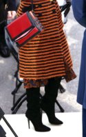 Katy Perry Jimmy Choo boot and Louboutin bag.jpg
