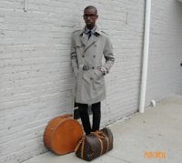 Lookbook boy in a khaki trench coat louis vuitton keepall 45 duffel bag samsonite hat box.jpg