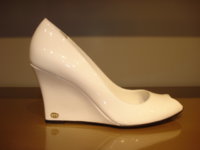 $209 White patent wedge.jpg