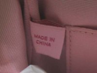 Coach Lurex Frame Wristlet Made in China Tag.jpg