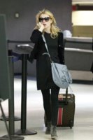 49021_EmmaRoberts_TakesacallasshearrivesatLAXAirportMarch102011_By_oTTo5_122_256lo.JPG