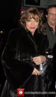 joan-collins-wearing-a-fur-coat-at_5810991.jpg