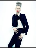 Kristen McMenamy wearing Saint Laurent jacket, blouse, pants, and neck bow from the stylewatcher.jpg