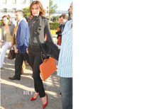 Nieves Alvarez wearing Jimmy Choo red shoes and black clutch in Seville, Spain.jpg