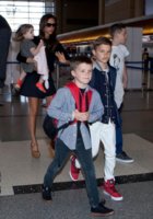 Victoria Beckham at LAX with Harper, Brooklyn, Cruz, and Romeo Credit zimbio.jpg