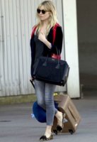 Sienna Miller with Jimmy Choo Terence croc-effect leather suitcase while in the South of France .jpg