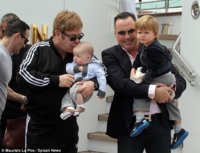 Sir Elton John and David Furnish were seen arriving in Venice, Italy, on Wednesday as they embar.jpg