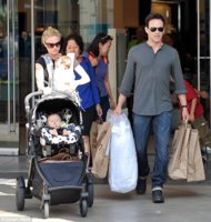 Anna Paquin juggled the twins while husband Stephen Moyer has the shopping bags for a family out.jpg