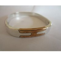 oval-bracelet-puzzle-silver-hermes.jpg