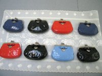 KisslockCoinPursesf65657NAV_BK_HotOrange_Cornflw.jpg