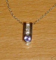 4mm tanzanite 2mm diamonds 14kt yg.jpg