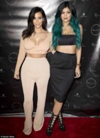 1415957524220_Image_galleryImage_Kylie_Jenner_poses_happil.JPG