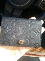 What fits inside of a Louis Vuitton Vernis Business Card Holder
