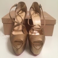 christian-louboutin-gold-pumps-1813857-1-0.jpg