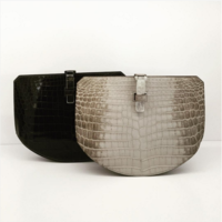 Hermes-Black-and-Beige-Crocodile-Baton-De-Craie-Clutch-Bags-Fall-2016.png