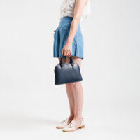 navy-leather-handbag-with-model.jpg