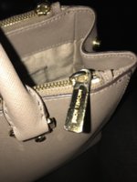 Can MK zipper pulls be replaced? | PurseForum