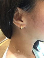 wearing Cartier Love earrings 