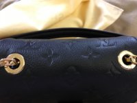 Exchanged my Pochette Metis - did I get a used one? The zipper is scratched  and the handle looks scratched as well. Didn't notice in the store. I also  feel like the