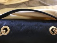 Exchanged my Pochette Metis - did I get a used one? The zipper is scratched  and the handle looks scratched as well. Didn't notice in the store. I also  feel like the