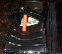 $100 bill coach wallet pocket.png