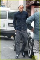 charlie-hunnam-sticks-out-his-tongue-to-taste-the-rain-01.jpg