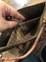 neverfull zipper pouch no date code or tags?