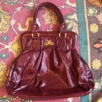 Maroon leather bag with fancy script M logo.jpg