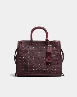 coach-rogue-in-natural-pebble-leather-with-prairie-rivets-black-copperoxblood.jpg