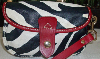 dooney zebra flap wristlet 1.png
