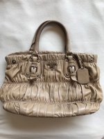prada_gauffre_handbag_in_camel_1549948391_c37657a3.jpg