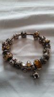 pandora with animal muranos charms and topaz.jpg