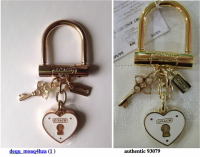dequ_moaq4hza fake coach lock heart fob vs authentic 93079.png