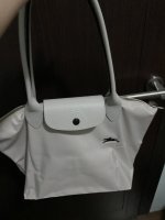 Longchamp Le Pliage is the one bag I will always recommend and keep on  buying as a laptop bag. And with the smaller footprint of 13” laptops now,  it can already fit