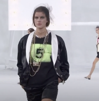 Chanel purse necklace.png