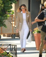 45110515-9761777-Back_in_the_Big_Apple_Melania_Trump_made_a_rare_foray_from_her_T-a-36_1625606...jpg