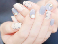 coffin shaped pastel plaid nails.png