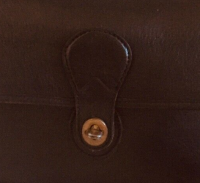 lamiaboutique fake coach turnlock closeup.png