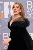 53935107-10490787-Ring_Adele_sparked_engagement_rumours_as_she_showed_off_a_diamon-a-278_16443...jpg