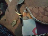 autoremoval fake coach wristlet - threatens legal action if removed hangtag_trim.jpeg