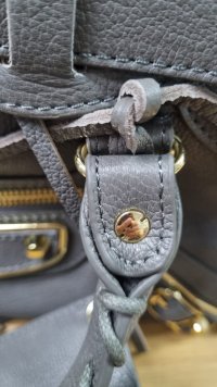 carousel grey rivet.jpeg