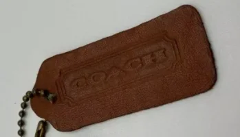Medium Brown Coach hang tag.webp