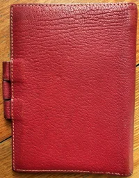 H notebook outside.webp