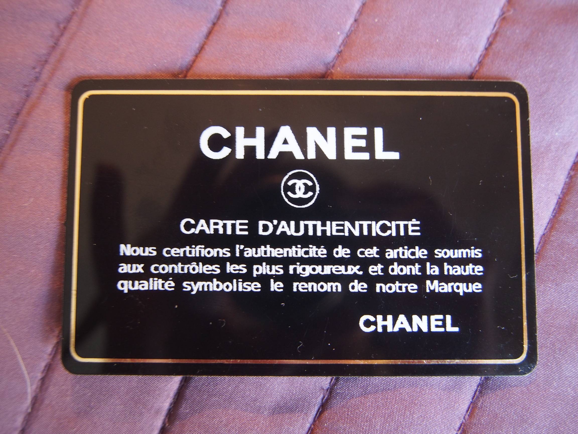 Chanel's authentication cards and hologram stickers. - Still in