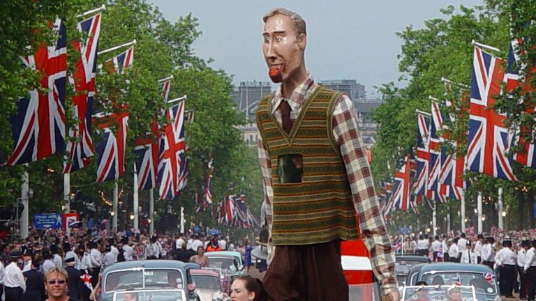 A giant puppet passes down the Mall during 2002 Golden Jubilee celebrations