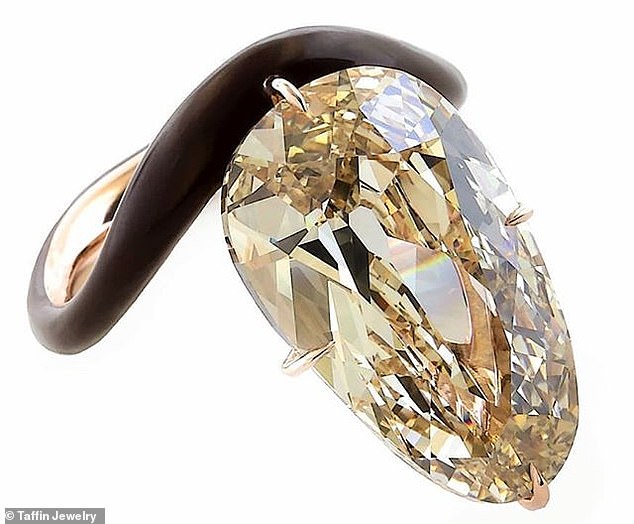 16364078-7274289-Massive_rock_The_11_carat_egg_shaped_light_brown_diamond_which_i-a-7_1563834446397.jpg