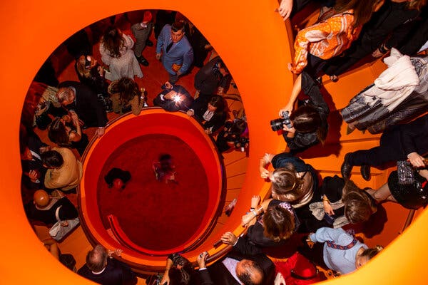 The former flagship, now closed, was transformed into an orange-colored speakeasy for the night.